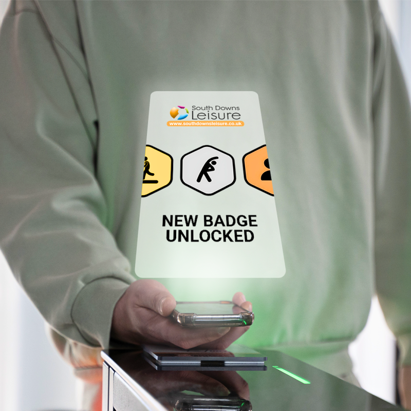 gamification, showing image of man holding the app with a pop up